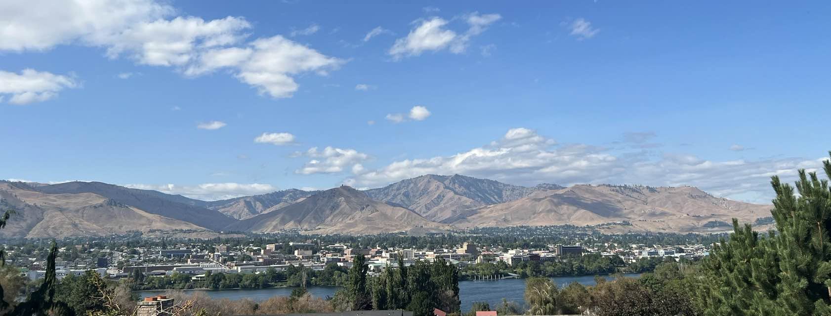 Downtown Wenatchee along the Columbia River with the surrounding hills